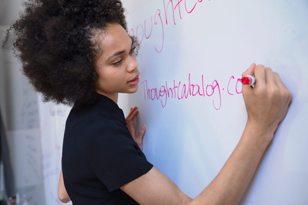 woman at dry erase board