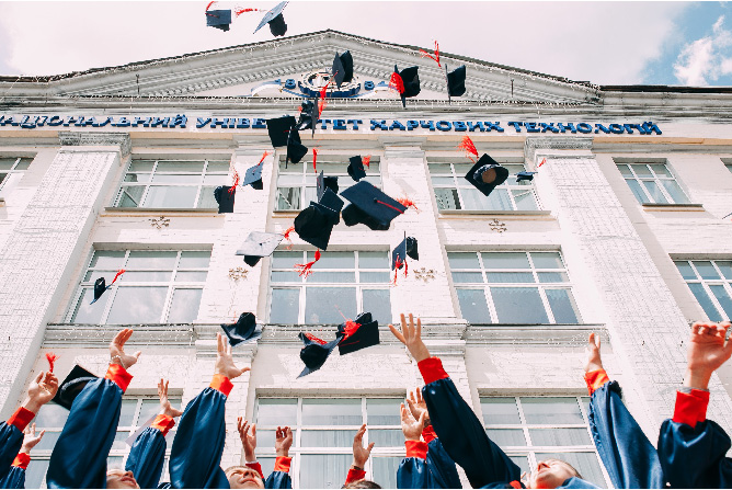 graduate caps thrown in the air